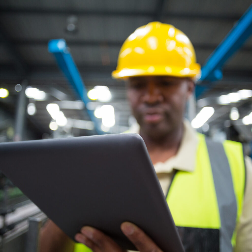 close-up-of-factory-worker-using-digital-tablet-in-project-environment-netsuite-erp