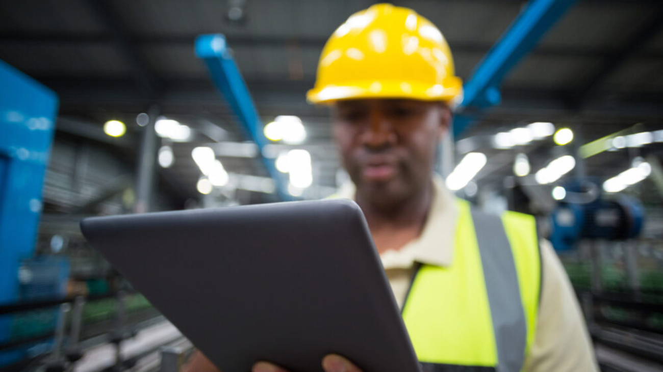 close-up-of-factory-worker-using-digital-tablet-in-project-environment-netsuite-erp
