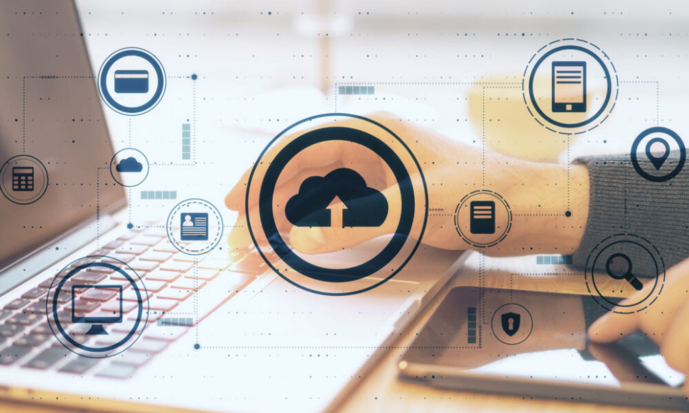 Cloud computing concept with laptop and tablet showing cloud-based ERP dashboard for small business systems
