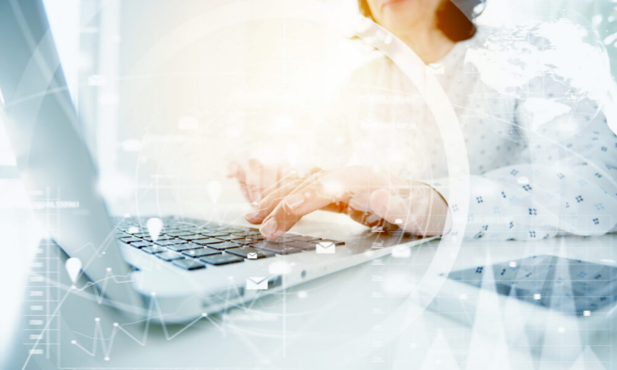 Woman typing on laptop with data overlay representing AI powered accounting software and accounting software with AI insights.